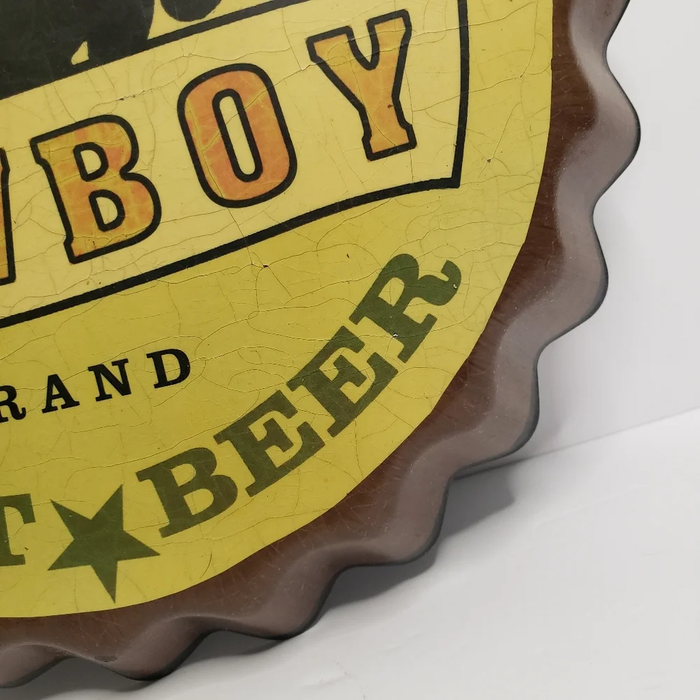 Metal Cowboy clock shaped like bottle cap. 191